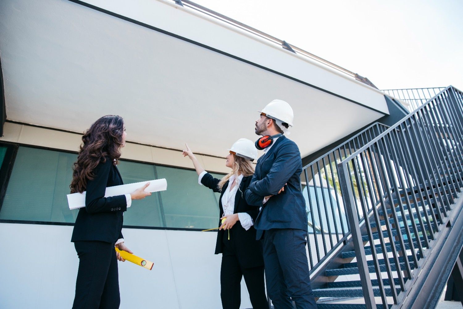 What to Ask a Sign Company Before You Sign the Contract architects engineers inspecting building construction site