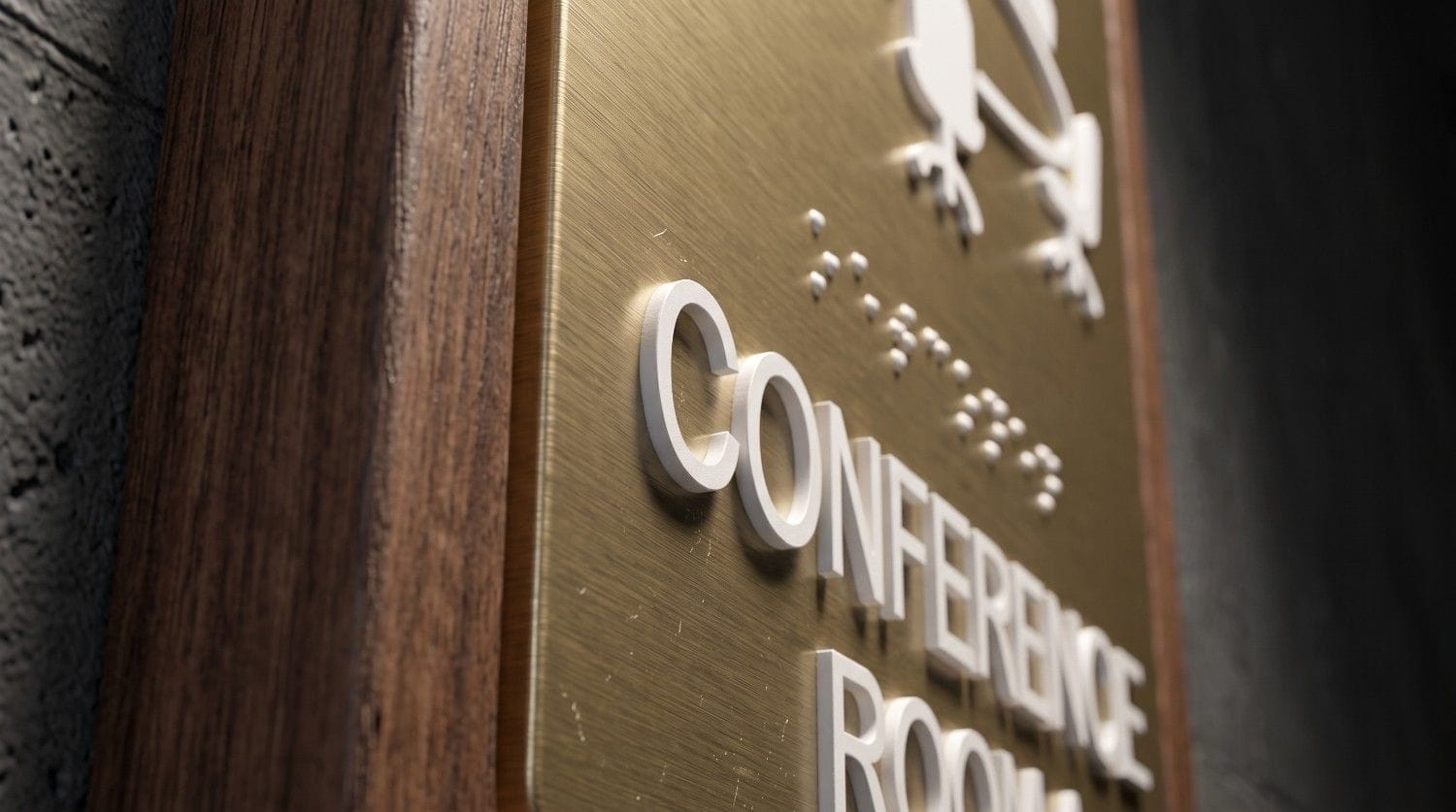 ADA Sign Requirements for Wisconsin Businesses: A Compliance Checklist modern ada conference room sign brass wood braille