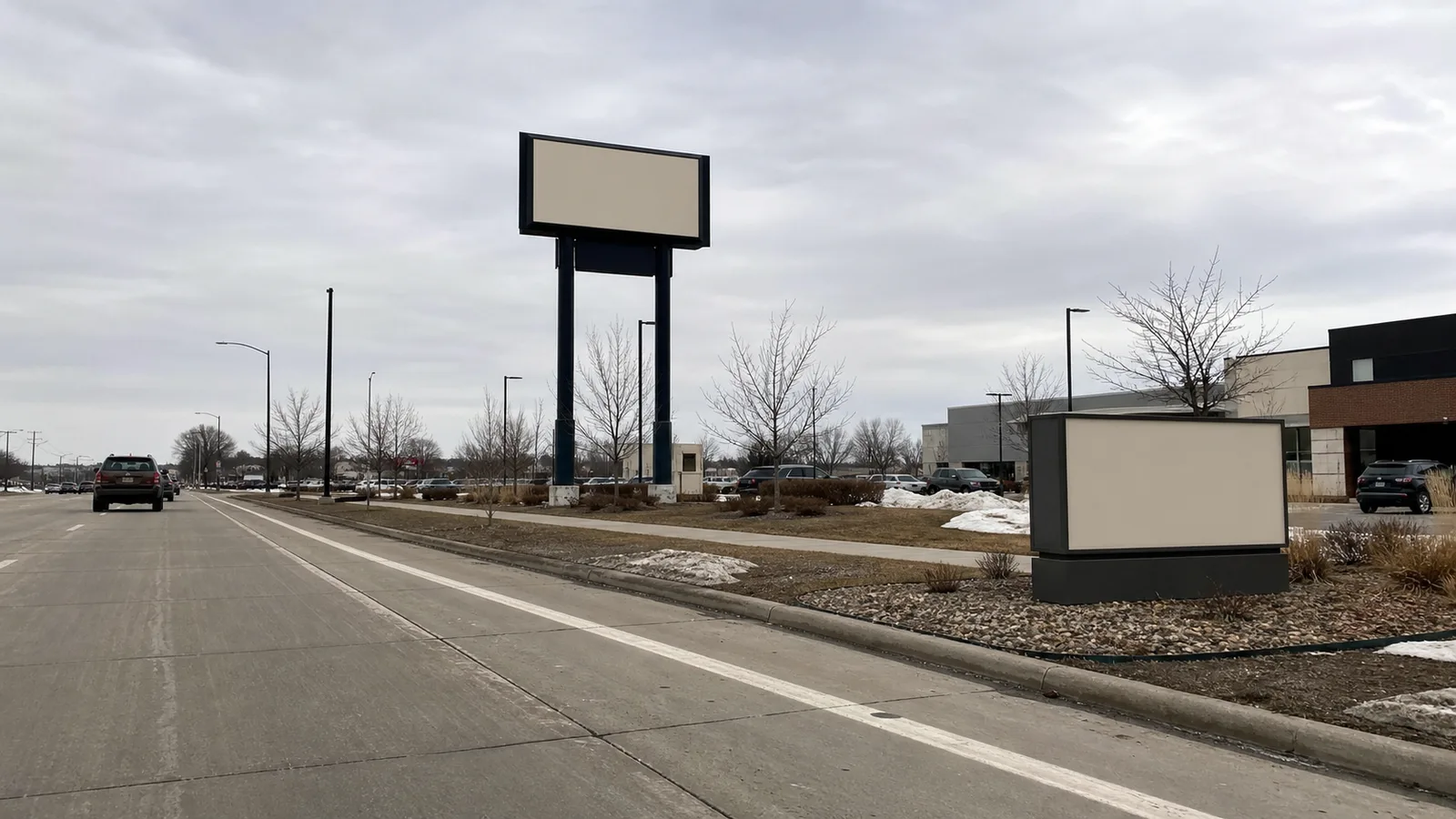 Tall pylon sign and low monument sign visible from a commercial road
